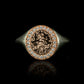 Hand engraved fantasy style signet ring in 9 carat rose gold and silver with diamonds. Features a fairy sitting on a mushroom patch. 